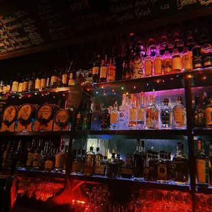 shelves of alcohol bottles and glasses