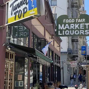 the outside of a restaurant with a sign that says food fair market liquors