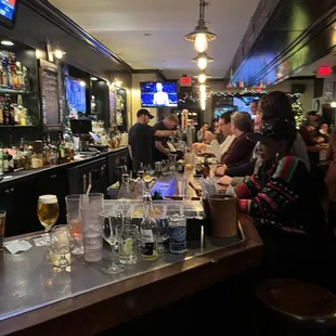 people sitting at the bar