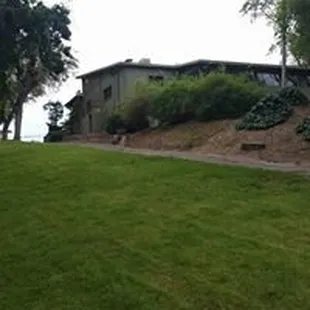 A view looking up at the our Hall from the lower grounds near the river.