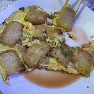 Pan fried rice cake with eggs