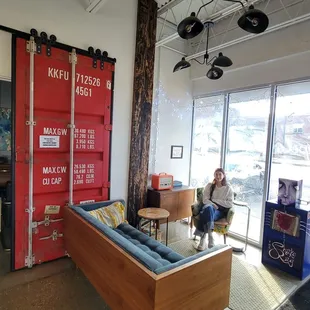 Nice barn door made from a train or contact door...casual spot to chill.