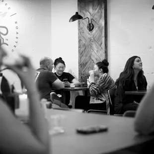 a group of people sitting at a table