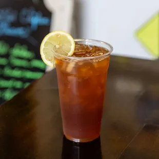 a glass of iced tea on a table