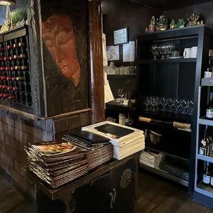 a wine shop with wine bottles and wine glasses