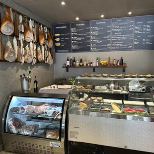 a deli counter with a variety of food items