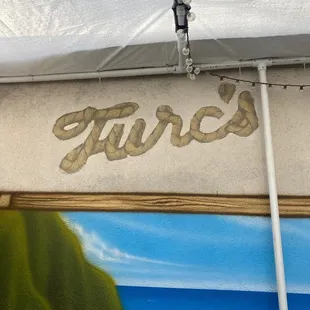 the word turcs painted on the side of a building