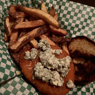 a sandwich and french fries in a basket