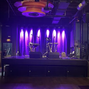 a stage with purple lighting