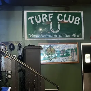 the entrance to the turf club