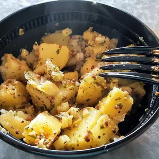 We were lucky enough to be they're for the debut of my favorite side, this hot, garlicky potato salad.