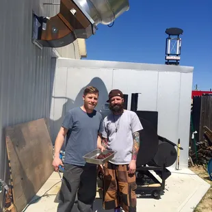 Our Chefs! Tim &amp; Matt smoking meat in the back.