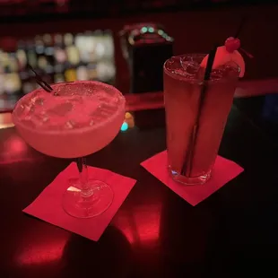 two cocktails on a bar