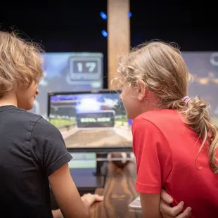 two children playing a video game