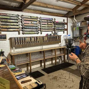 a man standing in front of a bar