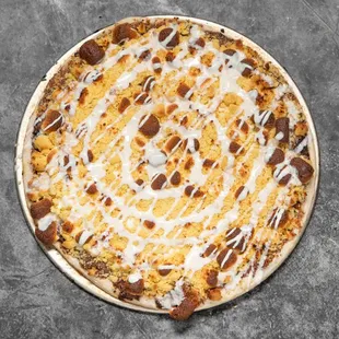 Indulge your sweet tooth with our s'mores dessert pizza!  A delicious twist on a campfire classic