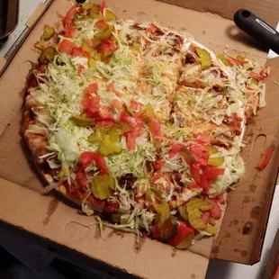 This was the pizza that was delivered to us after well over an hour. We had also requested tomatoes on the side.  Very upset.