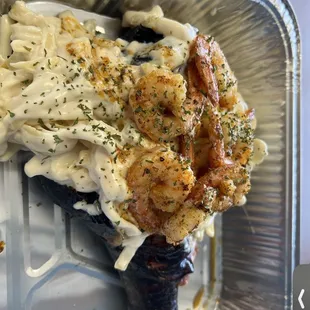 a piece of food in a foil container