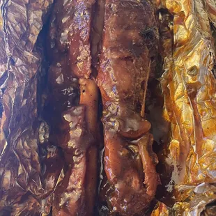 a close up of a piece of meat wrapped in foil