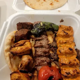 Combination of adana, kofte, lamb and chicken shish kabob, lamb and beef shawarma meat.