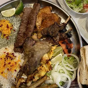 Mixed Persian Combo platter including: lamb kabab, chicken kabab, chicken, lamb shank, rices, lamb chops two lamb stews.