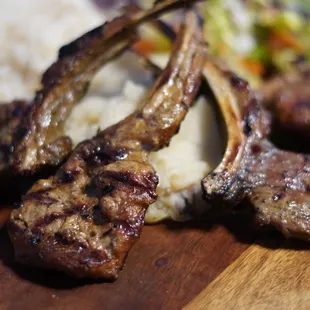 meat and rice on a cutting board