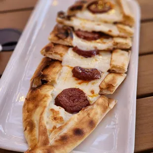 Spicy sausage pide