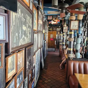 Hallway off the bar adorned with historic photos.