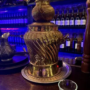 a teapot and a cup on a table