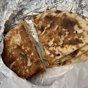 two quesadillas wrapped in foil