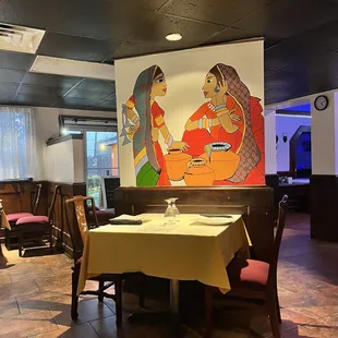 a table with a yellow tablecloth