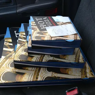 a stack of pizza boxes