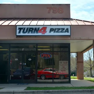a car parked in front of the store
