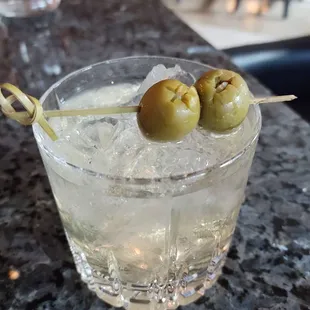Dirty Martini on the rocks. Stuffed olives.