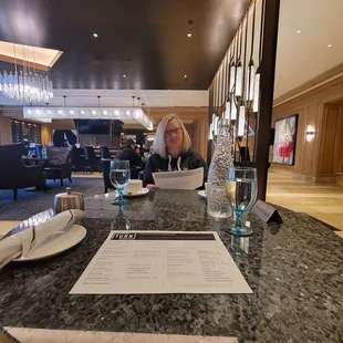 a woman sitting at a table