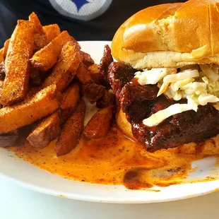 Nashville hot chicken sandwich with coleslaw (its spicyyy) with French fries.