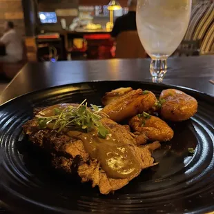 Ny Strip with peppercorn sauce served with seasoned twice cooked fingerling potatoes.