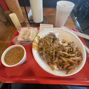 Pulled pork plate with fries and Brunswick stew. Crackers, white bread, and sweet tea.