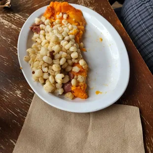 Potato patties and hominy. Sorry it&apos;s half gone. It was ssoo good.