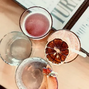 three glasses of different drinks