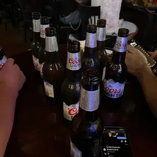 a table full of beer bottles