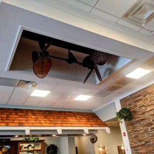a ceiling fan and fireplace