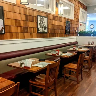 a dining area with tables and chairs