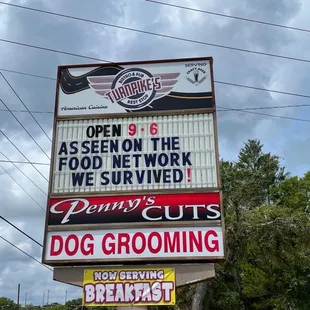 a sign for a dog grooming business