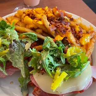 Broadway biscuit. Italian meats and seasoning on a biscuit. Knife and fork sandwich. Great flavors