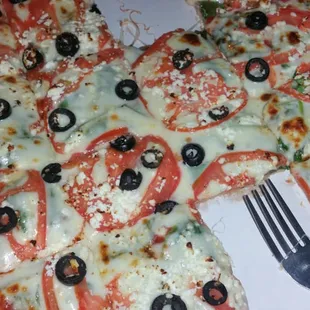a pizza with a fork and knife