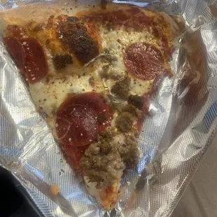 Fresh pepperoni and sausage slice