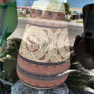 Looking through the window.