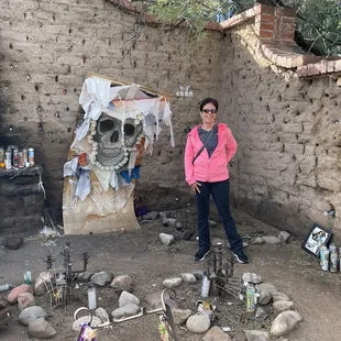 Pictured in front of the shrine of the sinner