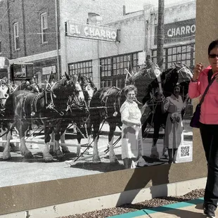 Me in front of an original photo of the first Hispanic Mexican restaurant in town El Charro